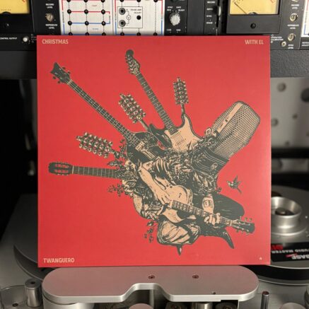 Album cover of Christmas with el Twanguero by Diego García (Twanguero) displayed on a vintage Studer tape machine.